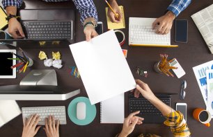 Group of Business People Working on an Office Desk